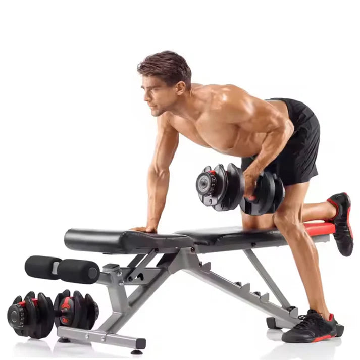 Man exercising with dumbbells on a weight bench against a white background