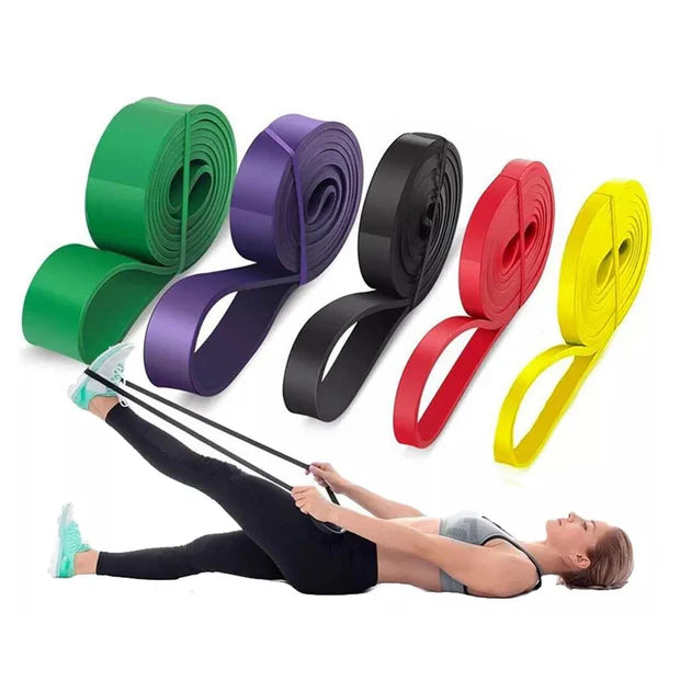 Set of resistance bands in various colors with a person using them on a white background