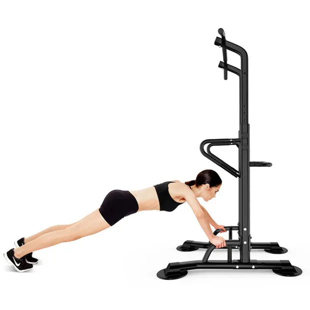 Person using a black pull-up bar and squat rack on a white background